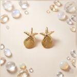 Aros Ocean Charm – Estrella de Mar y Concha Texturizada en Tono Dorado